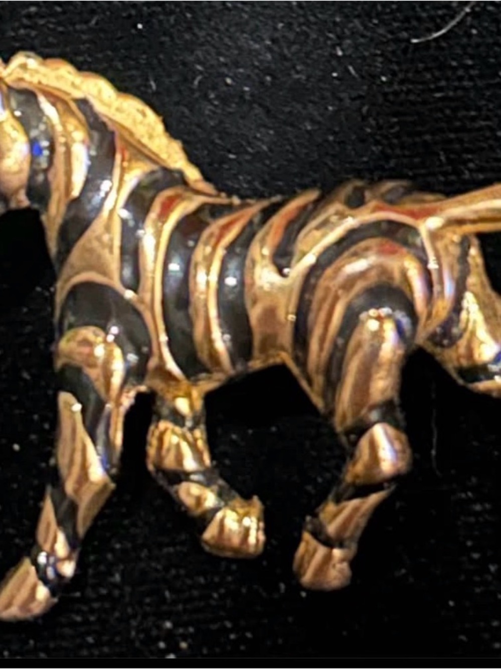 Vintage gold tone zebra brooch with turquoise eyes
